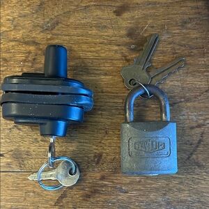 Black Steering Wheel Lock with Keys and a antique padlock with keys